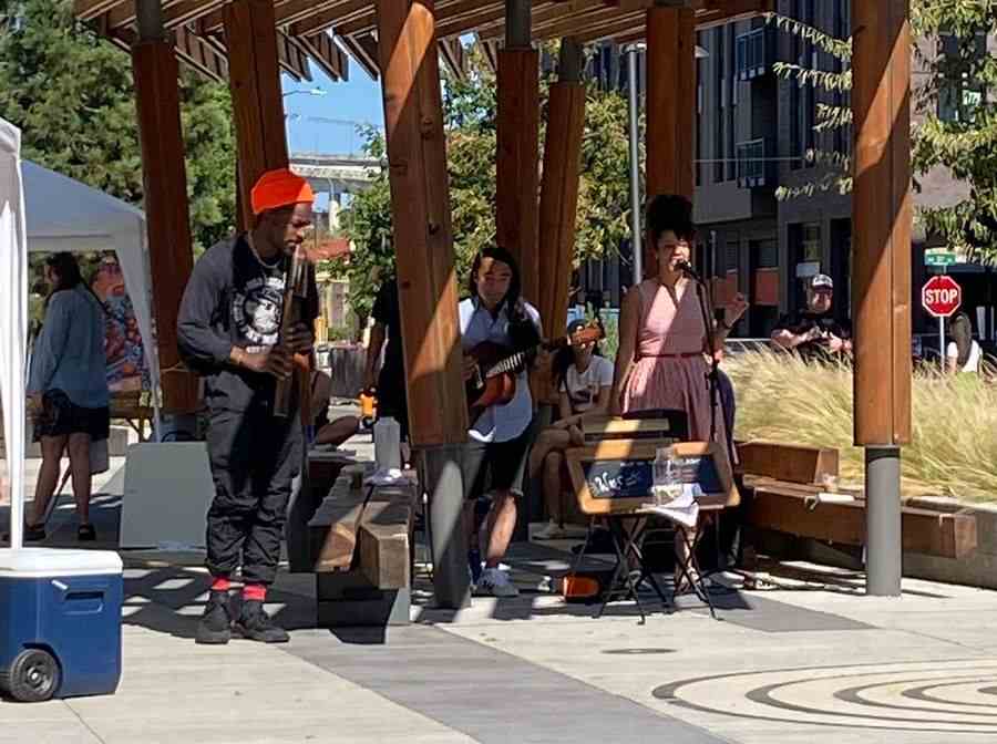 André 3000 performs with buskers in Portland